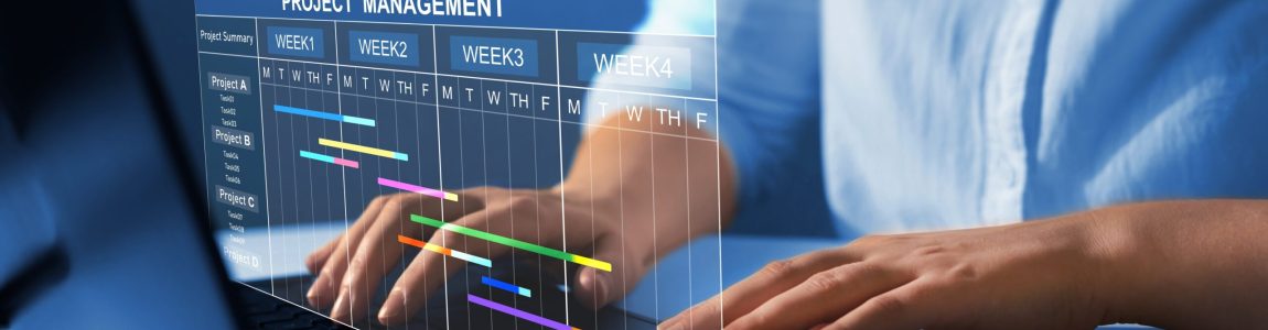 Project,Manager,Working,On,Laptop,And,Updating,Tasks,And,Milestones