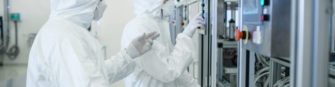 Team,Of,Scientists,In,Sterile,Protective,Clothing,Work,On,A