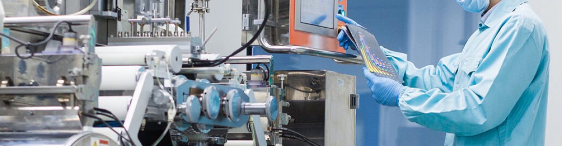 widescreen picture, caucasian scientist in blue lab suit trying to fix manufacture machine with shafts in clean factory